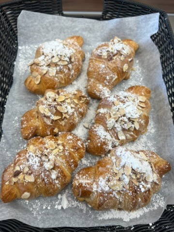 Almond croissants dusted with powdered sugar